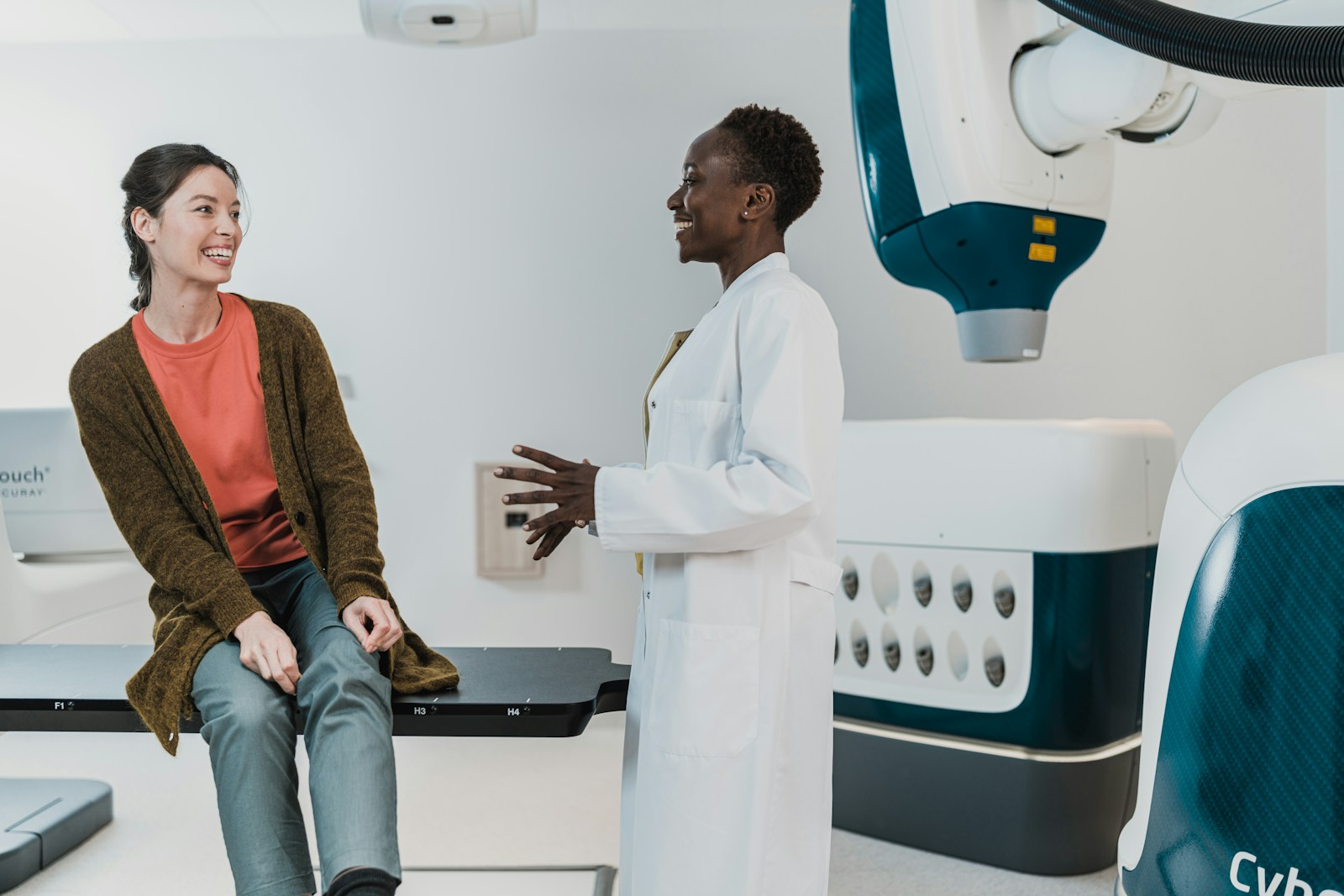 A doctor talking with a patient in a medical room
